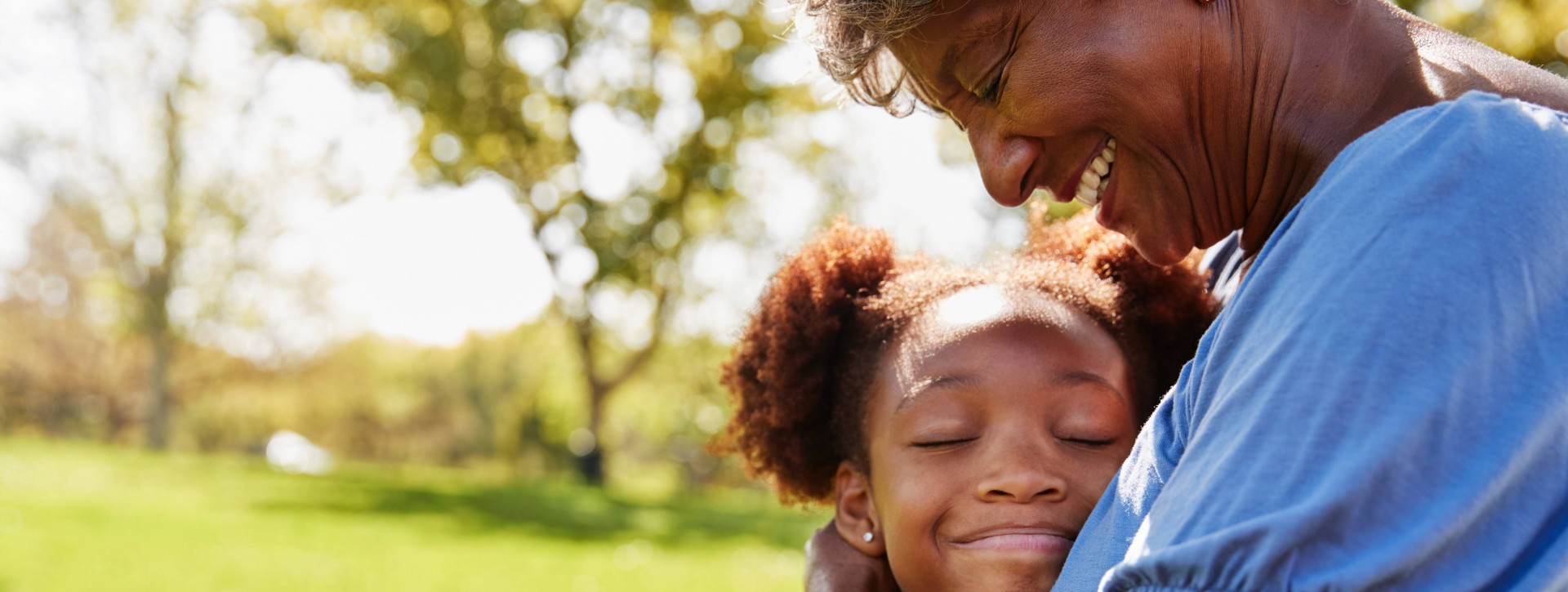 Grandmother hugging granddaughter 